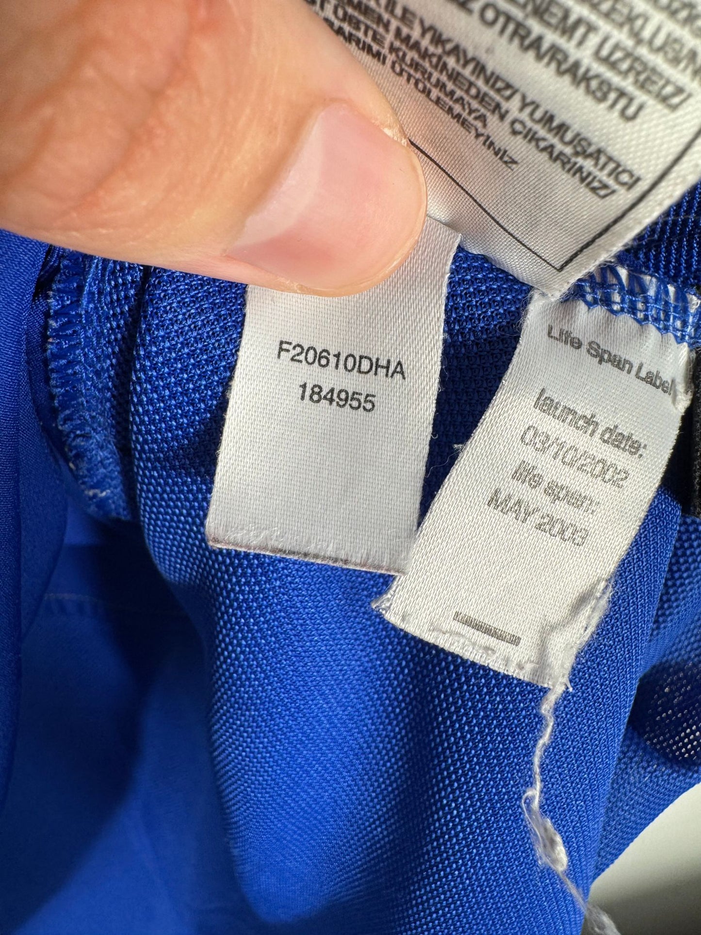 Étiquette intérieure d'authenticité avec code Nike 184955 prouvant l'originalité du maillot Manchester United third 2002-2003