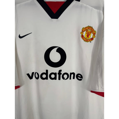 Détail de l'écusson de Manchester United et du logo Nike