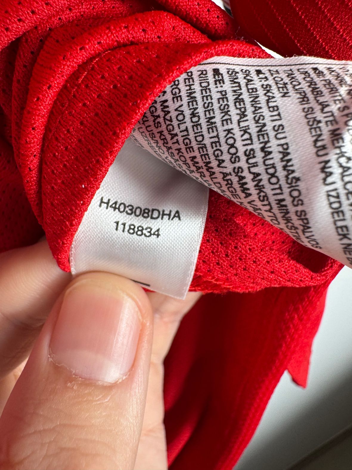 Étiquette d'authenticité avec code Nike 118834 prouvant l'originalité du maillot