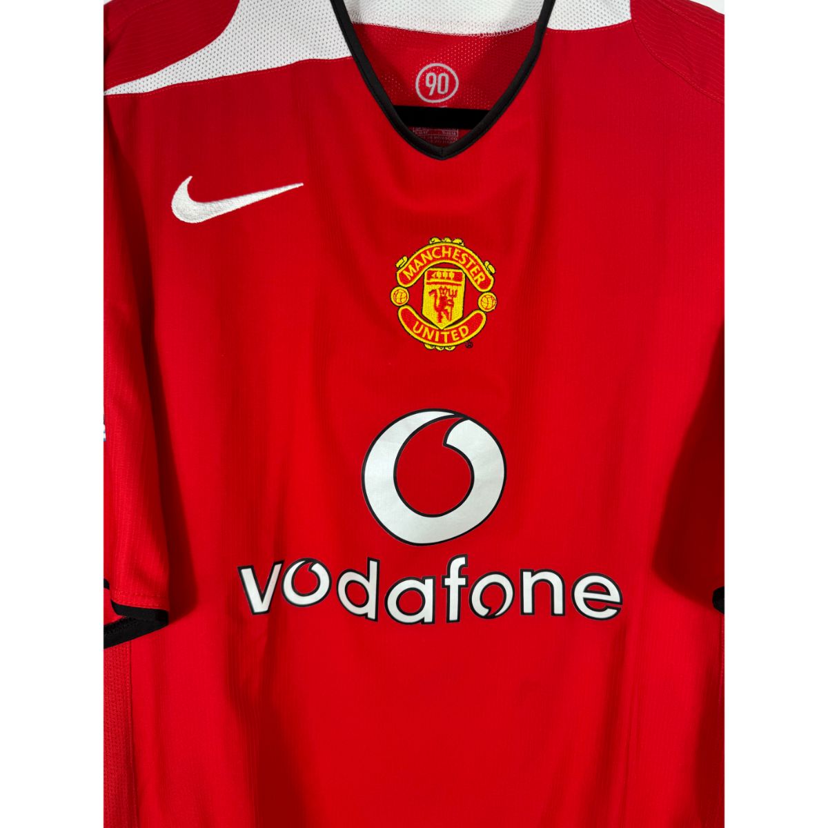 Détail de l'écusson de Manchester United et du logo Nike