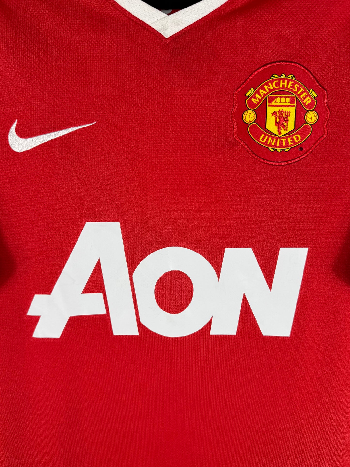 Détail de l'écusson de Manchester United et du logo Nike