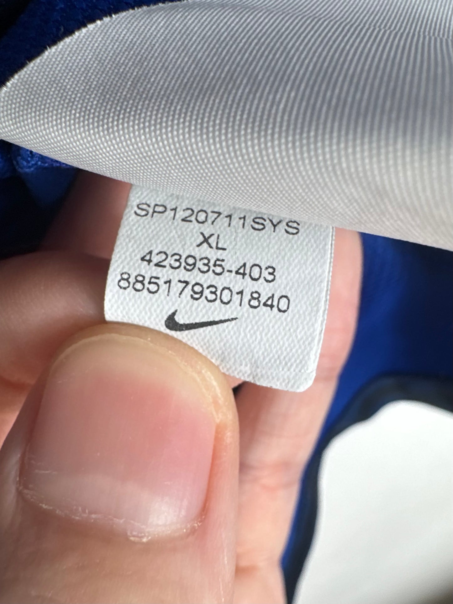 Étiquette d'authenticité avec code Nike 423935-403 prouvant l'originalité du maillot