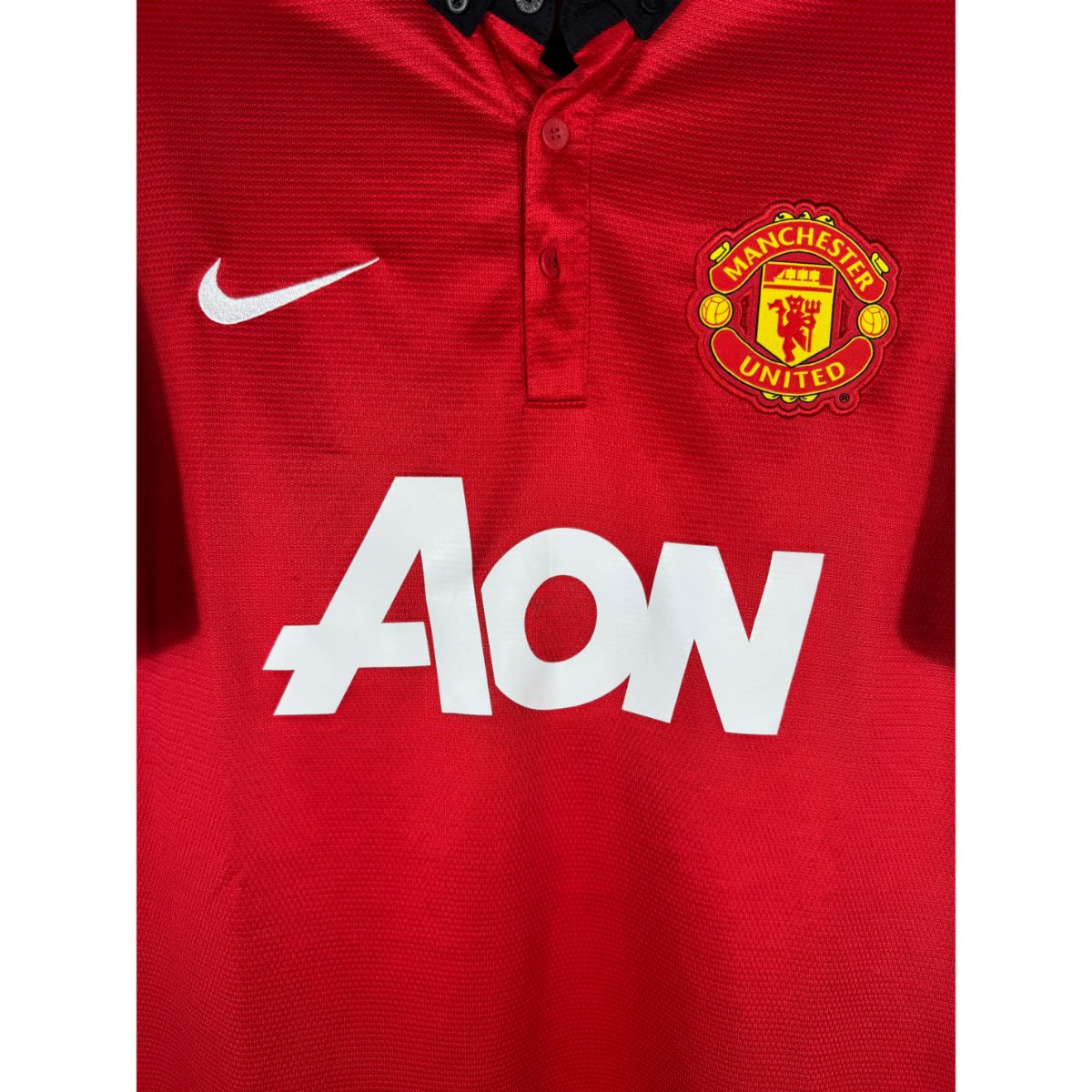 Détail de l'écusson de Manchester United et du logo Nike