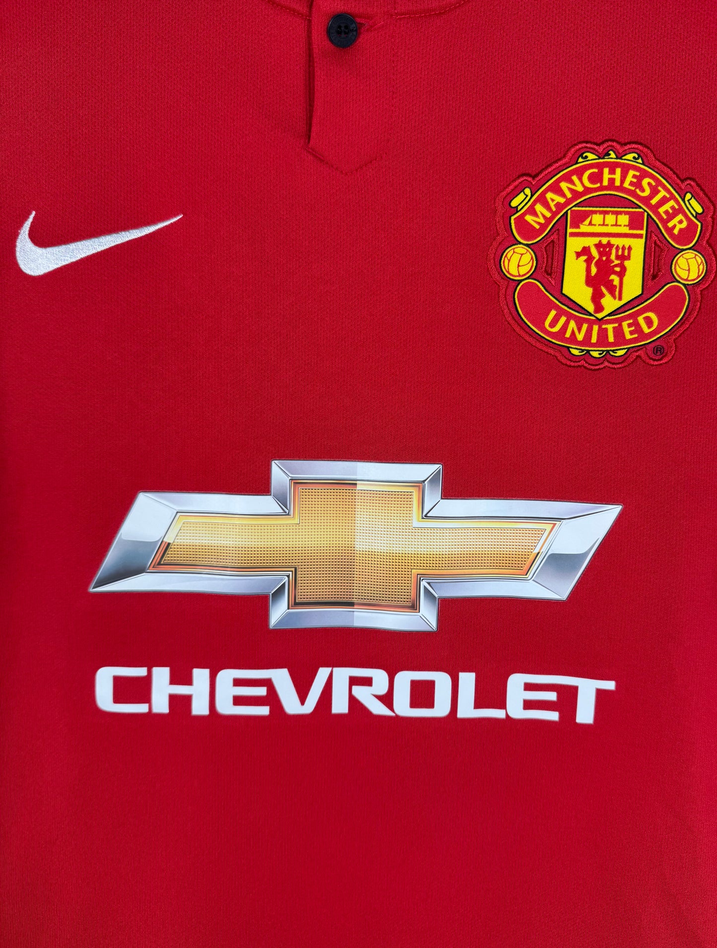Détail de l'écusson de Manchester United et du logo Nike