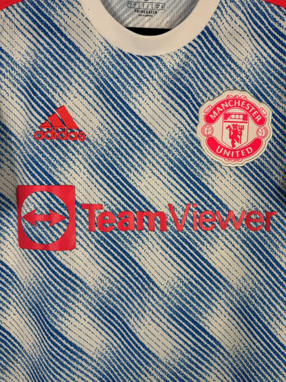 Détail écusson Manchester United et patch Champions League