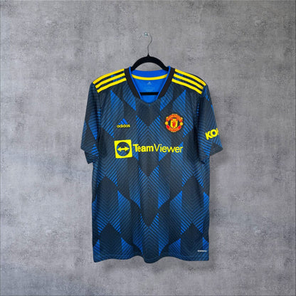 Maillot Manchester United third 2021-2022 Adidas face, motif chevrons bleus et bandes jaunes