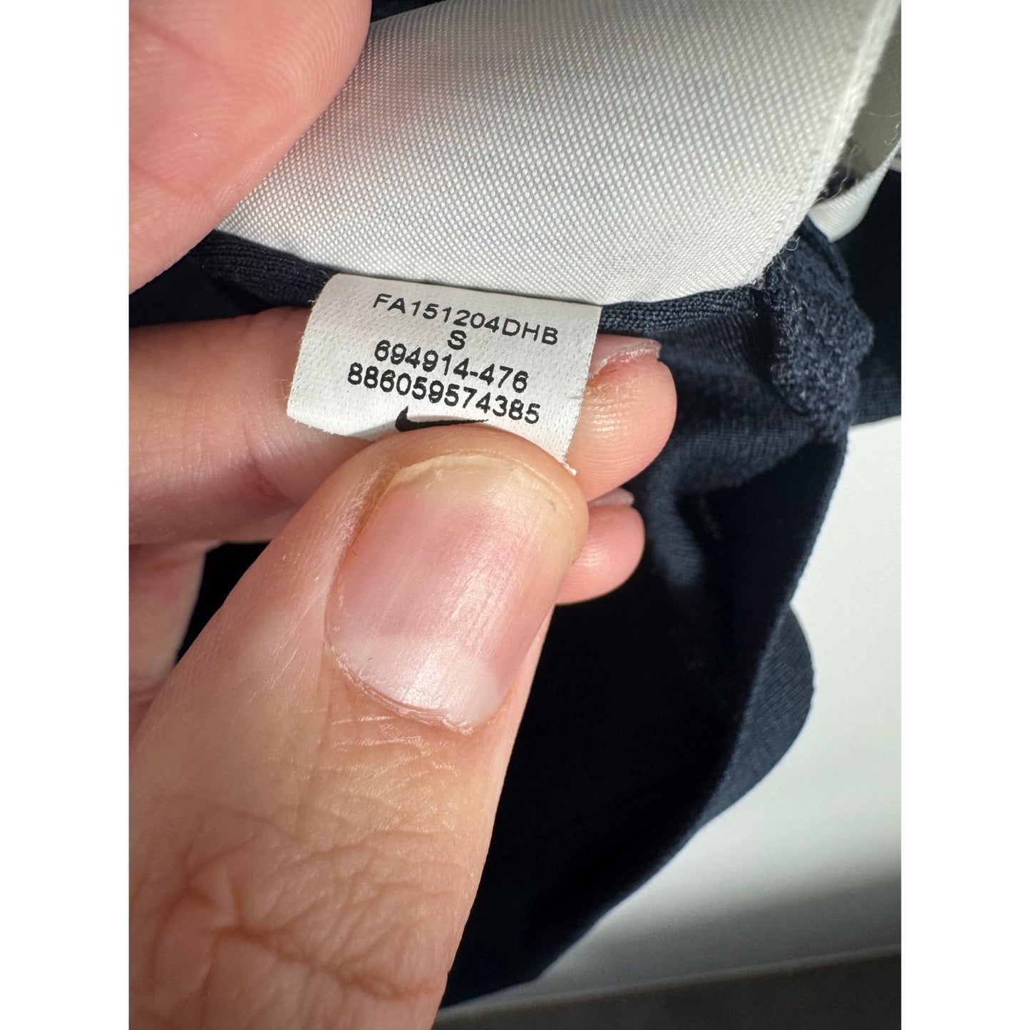 Étiquette d'authenticité avec code Nike 694914-476 prouvant l'originalité du maillot