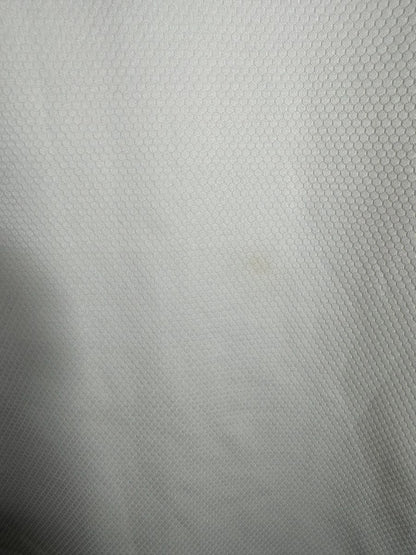 Détail micro tache maillot OL 2020-2021 domicile