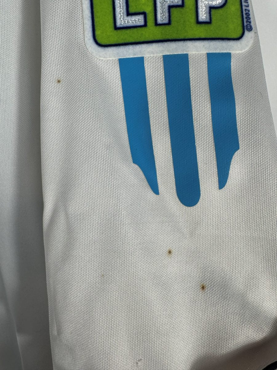 Défaut : micro points et petites taches sur la manche, maillot OM domicile 2005-2006