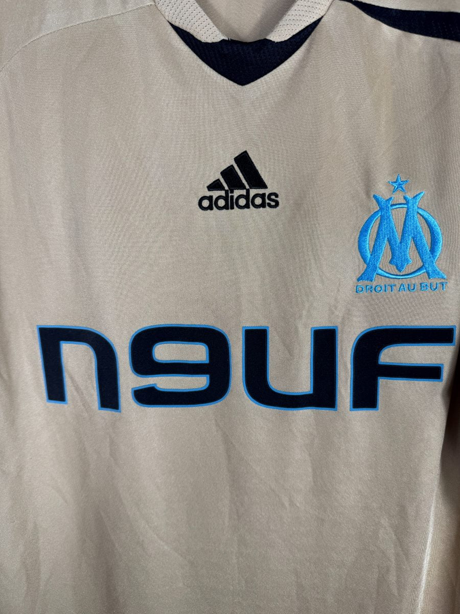 Écusson brodé Olympique de Marseille Droit au But et sponsor n9uf sur le maillot third 2008-2009
