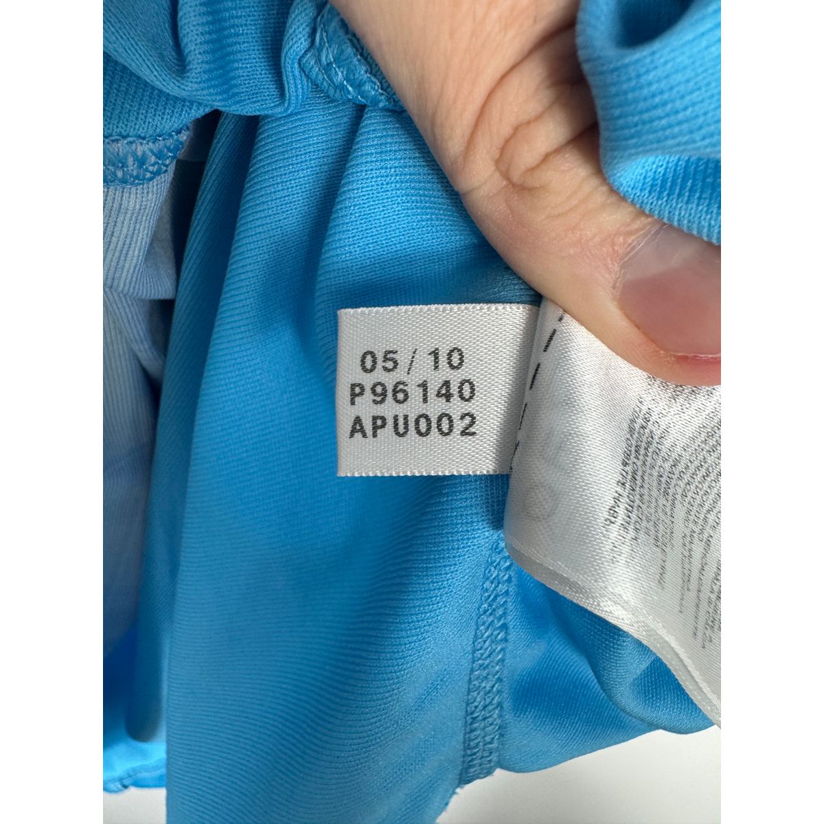 Étiquette d'authenticité avec code Adidas P96140 prouvant l'originalité du maillot