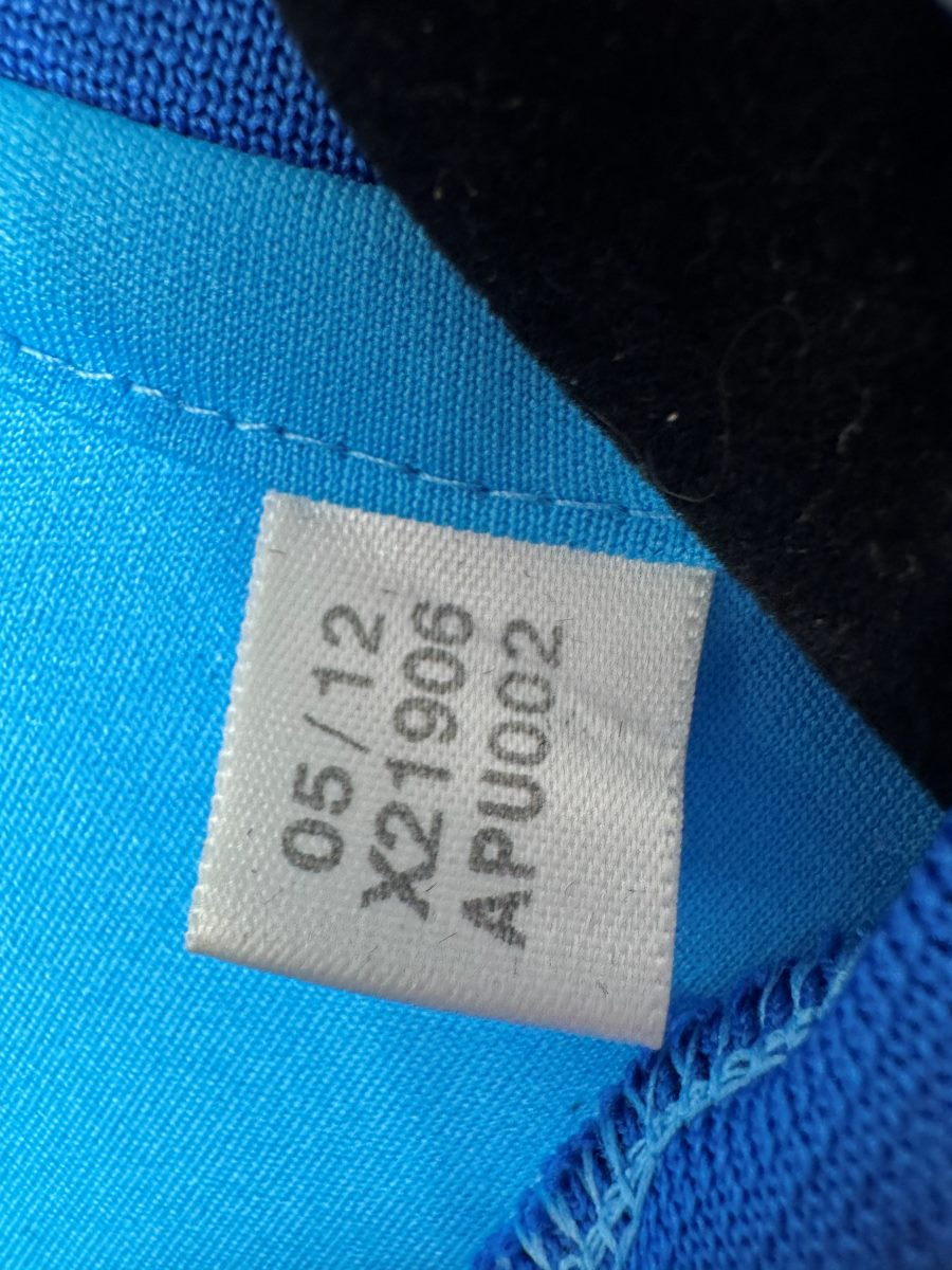 Étiquette intérieure adidas du maillot OM 2012-2013 extérieur, référence X21906 datée 05/12
