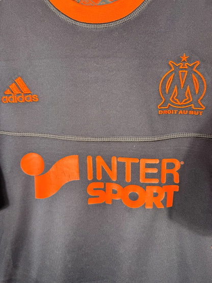Écusson OM orange, logo adidas et sponsor Intersport, maillot third 2012-2013