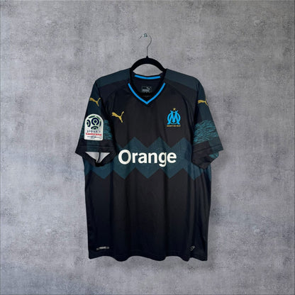 Face du maillot Olympique de Marseille 2018-2019 extérieur noir à chevrons turquoise, sponsor Orange