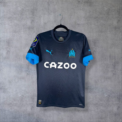 Face du maillot OM 2022-2023 extérieur Puma bleu marine avec le sponsor CAZOO