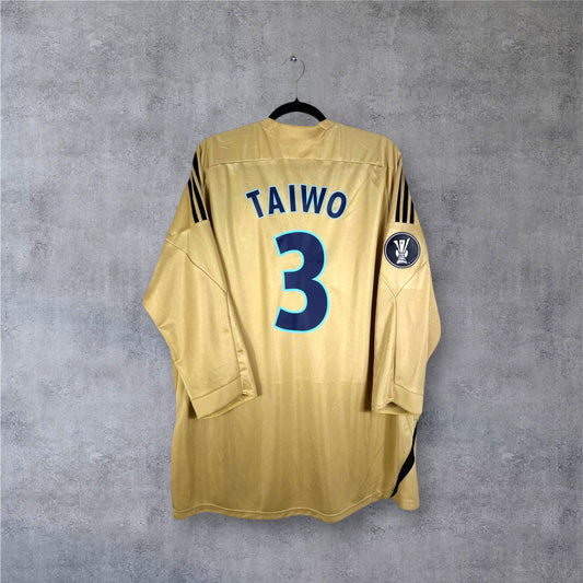 Dos du maillot OM 2009 Third couleur Or avec flocage bleu TAIWO 3 et patch sur la manche.