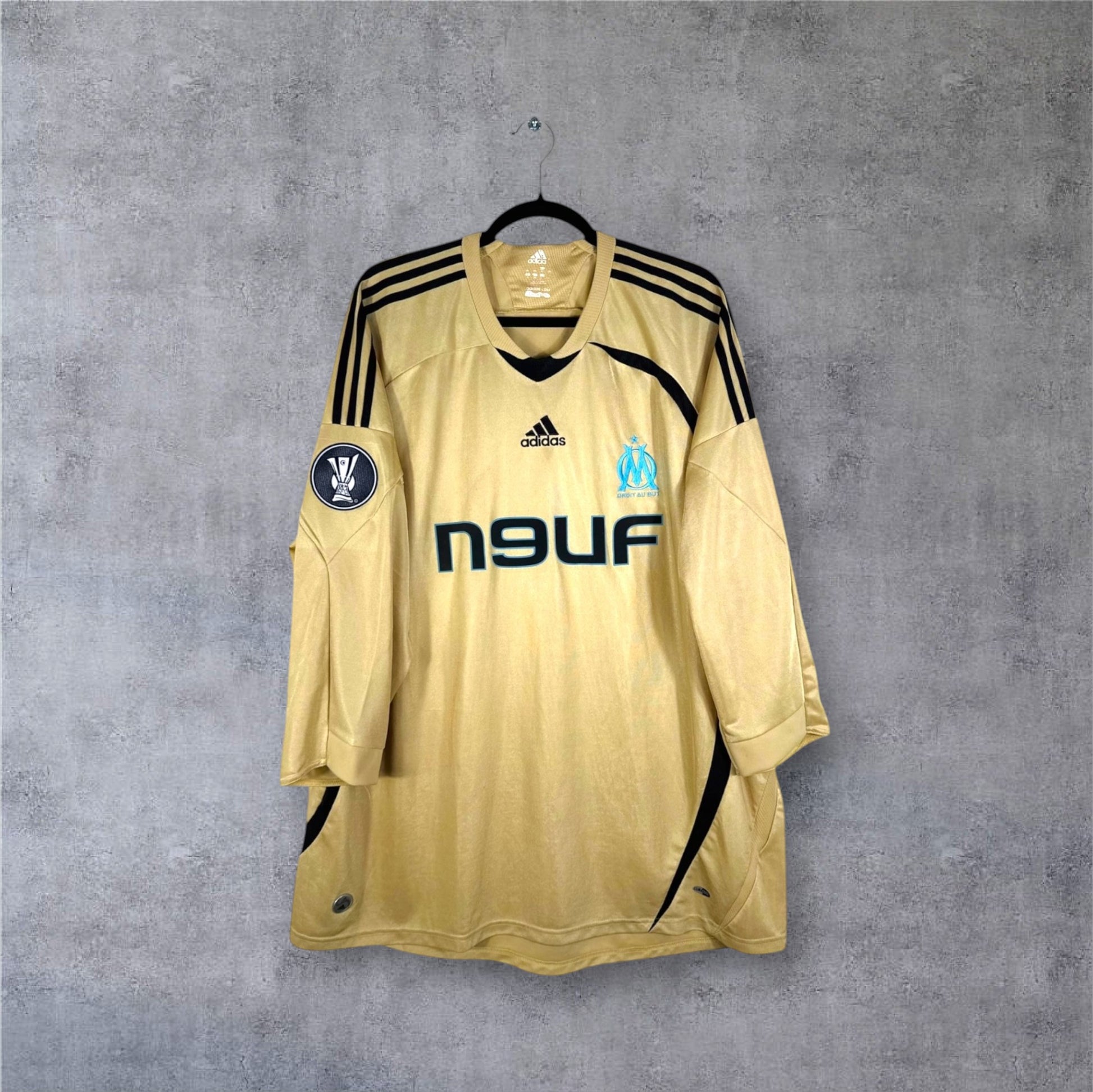 Vue de face du maillot Olympique de Marseille Third 2008/09 Or avec sponsor n9uf bleu.