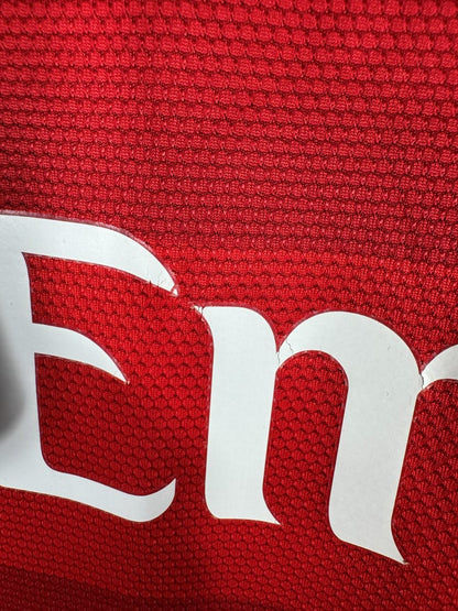 Léger craquèlement sur les lettres E et M de Fly Emirates, maillot PSG 2012-2013 extérieur