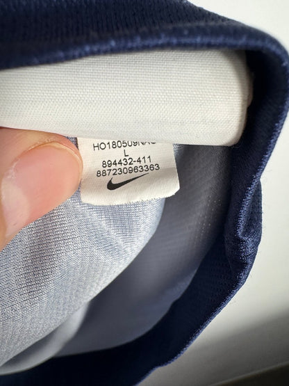 Étiquette d'authenticité avec code Nike 894432-411 prouvant l'originalité du maillot