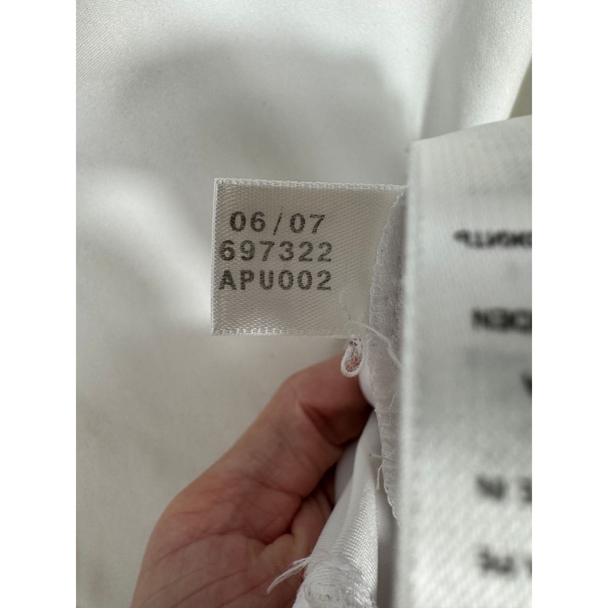 Étiquette d'authenticité avec code Adidas 697322 prouvant l'originalité du maillot