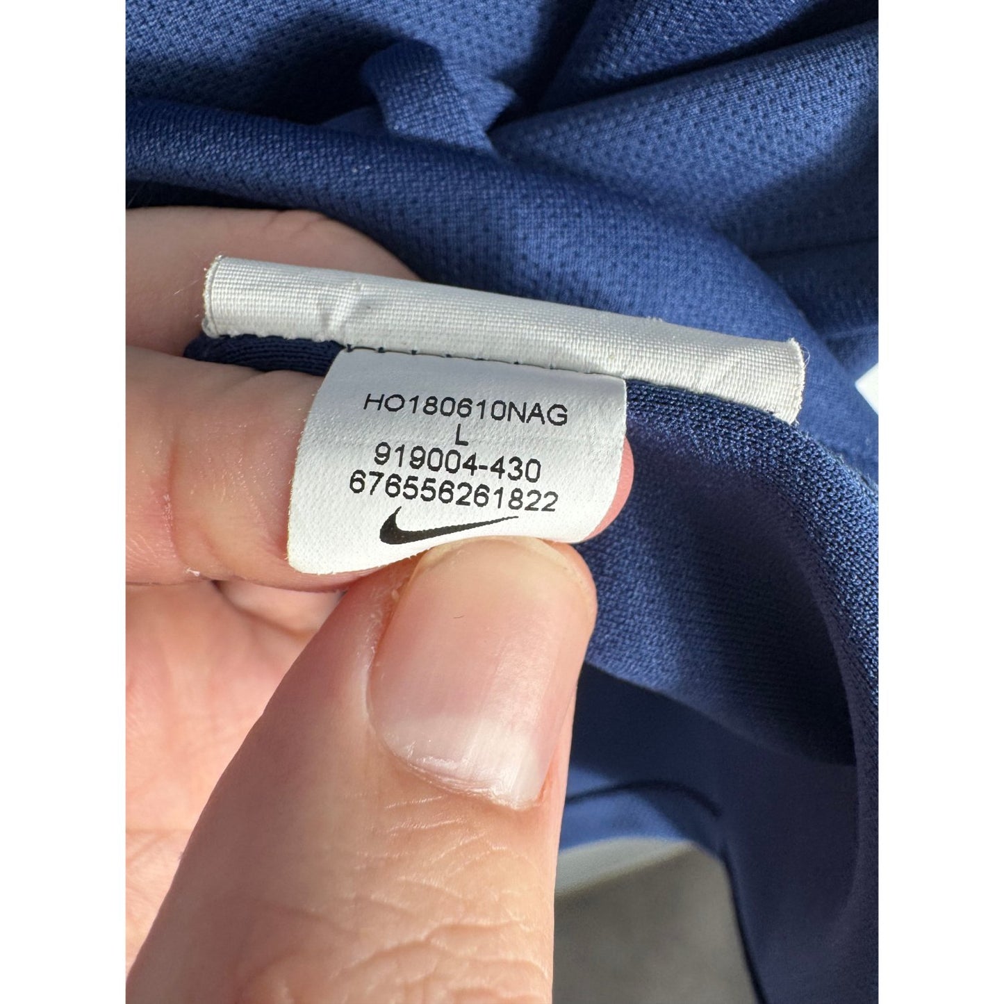 Étiquette d'authenticité avec code Nike 919004-430 prouvant l'originalité du maillot