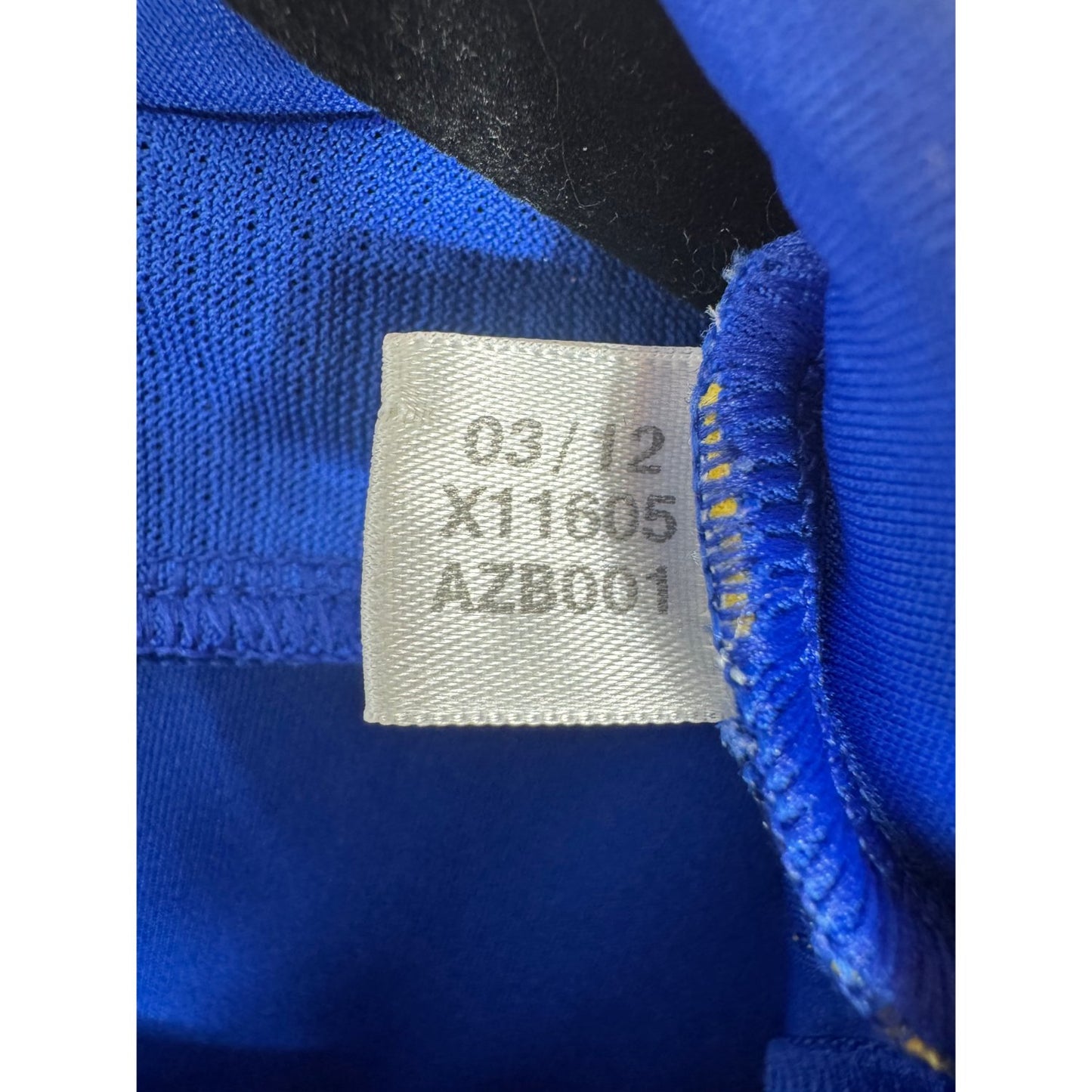 Étiquette d'authenticité avec code Adidas X11605 prouvant l'originalité du maillot